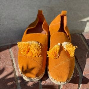 Tom’s suede tassel slip ons